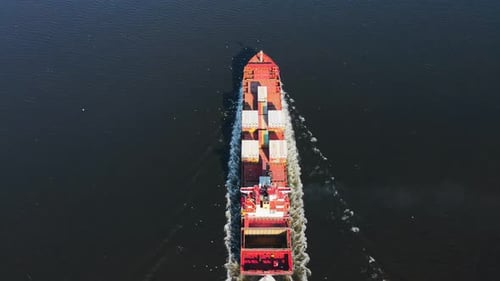 Container Ship Sailing on Sea to Transport Cargo at Port