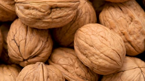 Close Up Of Rotating Shelled Walnuts