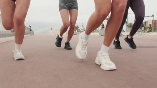 friends jogging by the sea