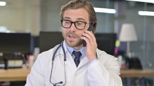 Doctor Talking on the Phone in Office