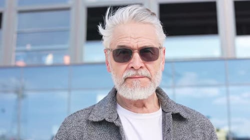 Senior Man with Gray Hair Poses Outdoors