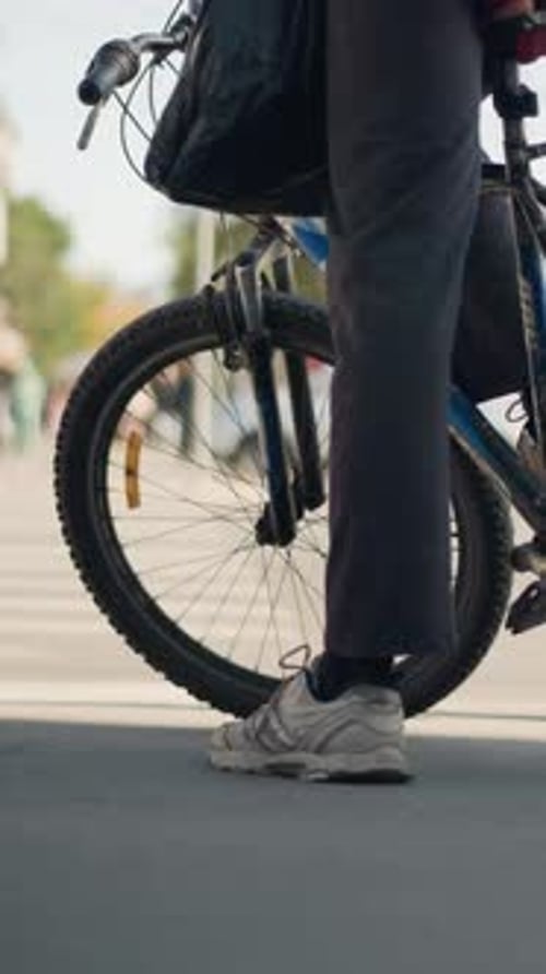 Street Rider Waiting City Cyclist Pauses with Bicycle Tire Near Sidewalk During Dawn An Everyday