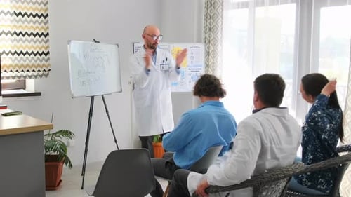 Medical Staff Attending Meeting With Doctor