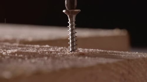 Screwing Wooden Board By An Electric Screwdriver. Closeup, Macro