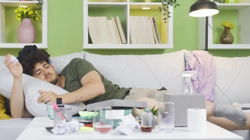 Young Adult Lying Down in Messy Room