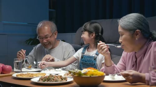 Family Meal at Night in Home Setting