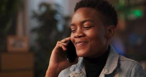 Young Adult Talking on Phone Indoor