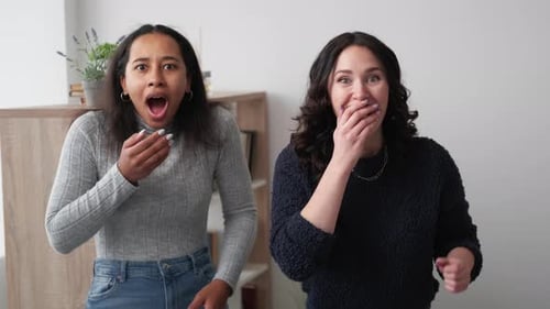 Women Reacting with Shock and Elation