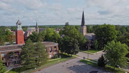 Aerial of multiple steeples and clock towers