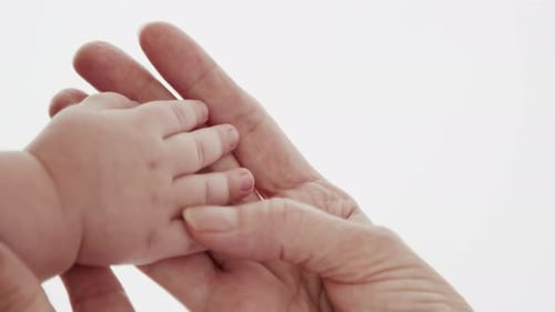 Newborn Baby Holding Old Grandma Hand Close-Up. Joy Togetherness And Caressing Cuddle Of Kid And ...