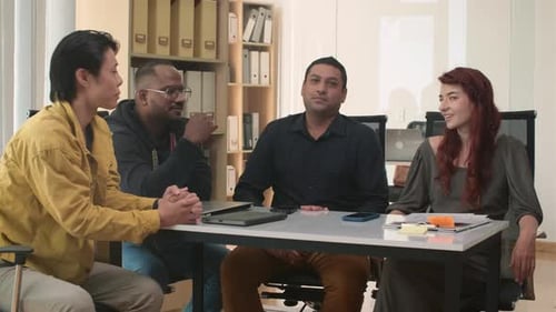 Diverse Team Meeting in a Modern Office