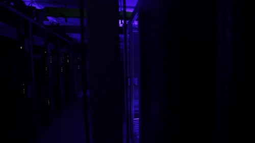 Inside a blue lit server room with nobody, data storage center, establish