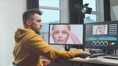 Freelance Videographer Colorist Editing Footage Using Professional Software Monitor and Montage