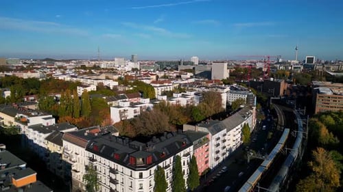 city Train tracks over river bridge, colorful fall. Lovely aerial view flight drone