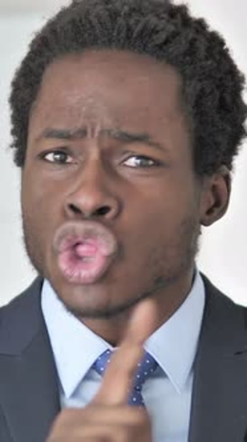 Young Man Gesturing Shh Quiet Hush Close Up