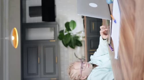 Distance Learning Online Education Schoolgirl Studying at Home with Laptop and Doing School Homework