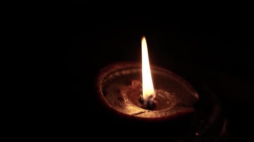Glowing Diya Oil Lamp in the Dark