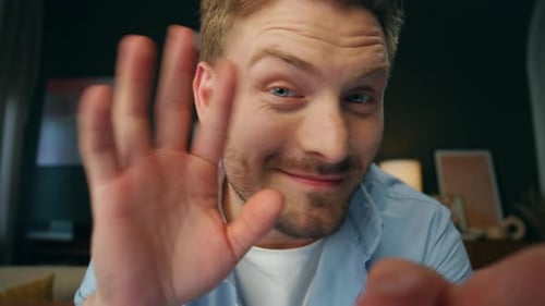 Pov Smiling Man Greeting Screen at Home Office Joyful Blogger Guy Waving Hand