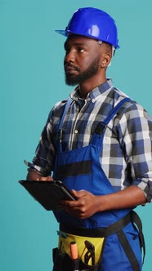 Vertical Video Confident Mechanic Using Tablet for Calculations