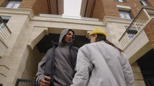 Two Young Adults Dancing in the City