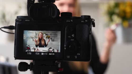 Blonde Woman Records Makeup VLog at Home