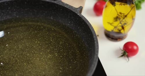 Sunflower Oil Boiling in a Hot Frying Pan on Electric Induction Stove