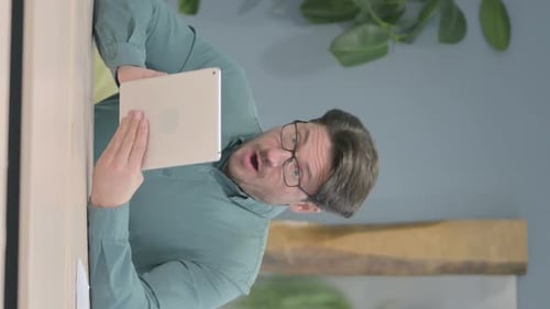 Man Expressing Shock While on a Tablet Video Call