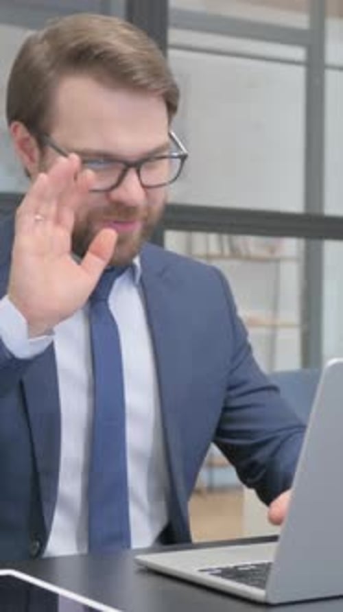 Man Typing on Laptop in Office Vertical Video