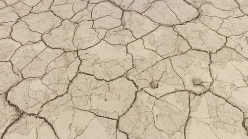 Aerial of the cracked surface of a dry lake