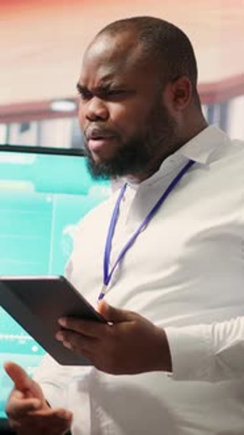 Business Professional Presenting Data at Office Presentation