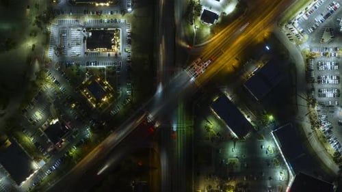 Top View of Large Multilane Road Intersection with Traffic Lights and Moving Cars in American City