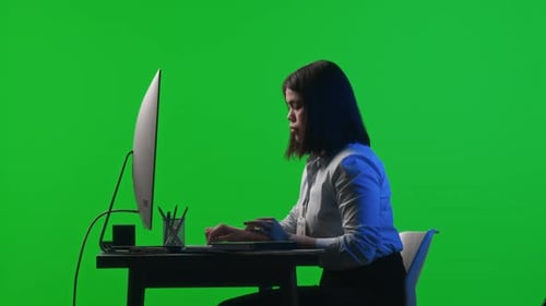 Female Office Worker Using Computer on Chroma Key Background