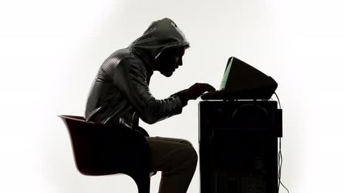 Person Typing at a Vintage Computer Setup