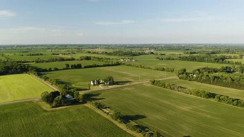 Aerial View of Verdant Rural Farmland on Sunny Day