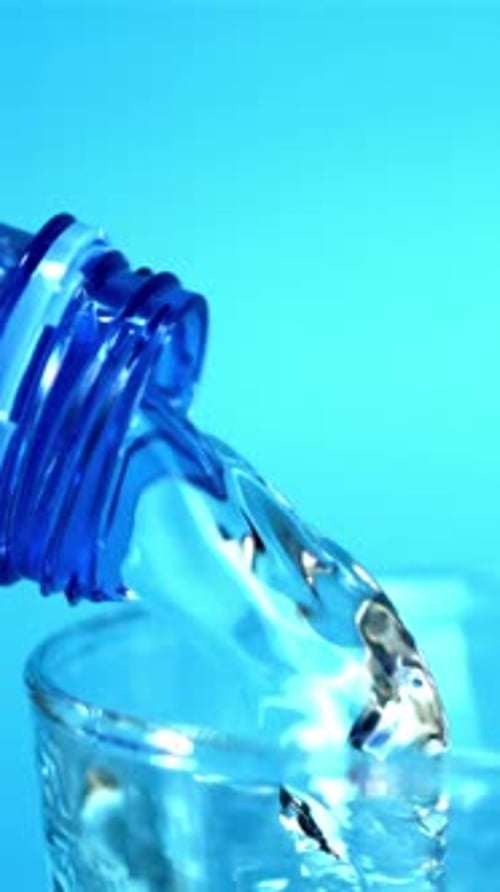 Super Slow Motion Water Pours From Bottle to Glass Filmed on a Highspeed Camera at 1000 Fps