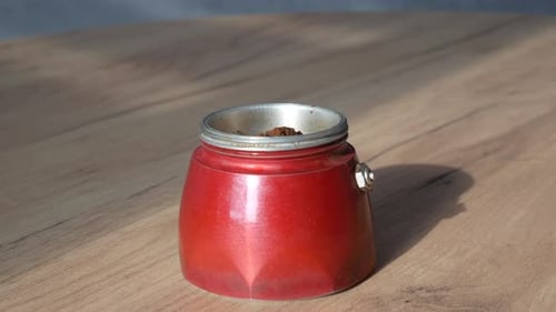 Filling Red Moka Pot with Ground Coffee