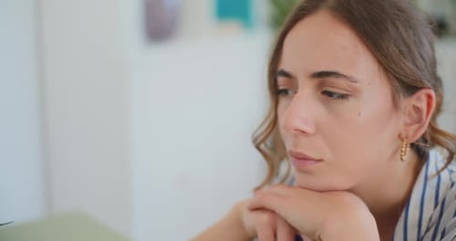 Woman Resting Chin on Hands