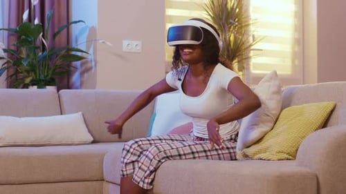 Woman Experiencing Virtual Reality in Living Room