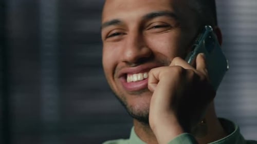 Young Adult Smiling, Talking on Cell Phone