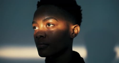 Woman's Face Illuminated by Golden Light