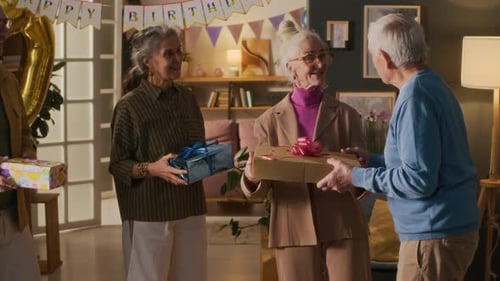 Seniors Celebrating Birthday With Gifts and Good Cheer