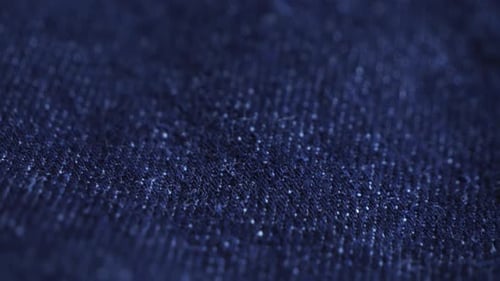 Texture of blue jeans close-up. Concept of background and texture.