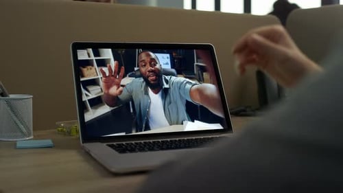 Office Clerk Video Call Laptop Greeting with African American Colleague Close Up