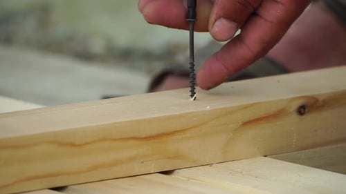 Securing Wood Plank With Power Drill And Screw