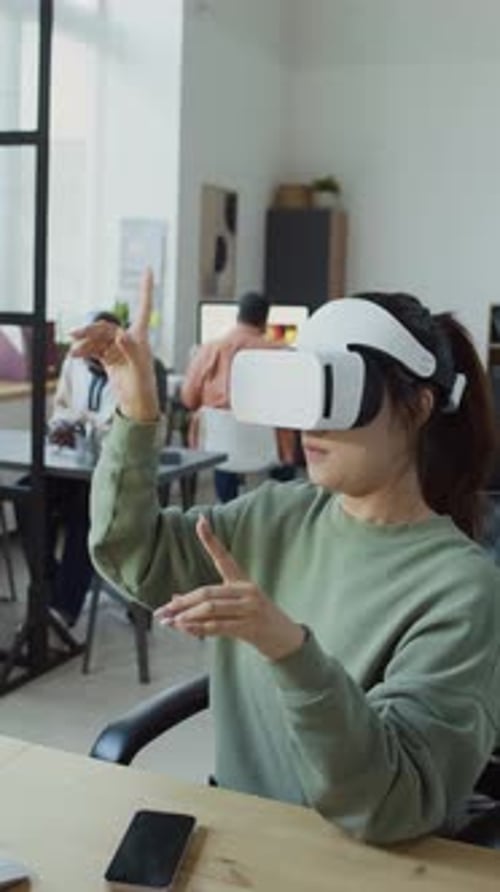 Female Developer in VR Helmet Working with Project in Augmented Reality