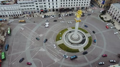 Aerial View of City Square with Golden Monument