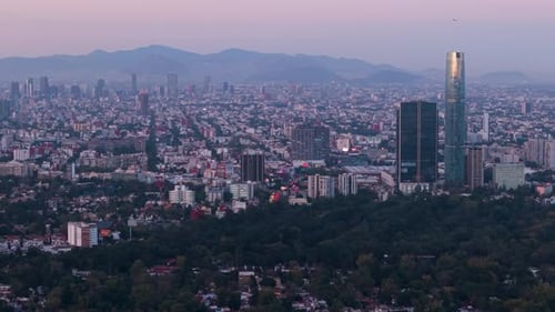 Drone footage showing purple twilight tones over south Mexico City