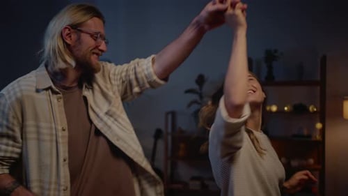 Loving Couple Dancing in Living Room at Night