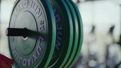Adding Weights to Barbell in Gym
