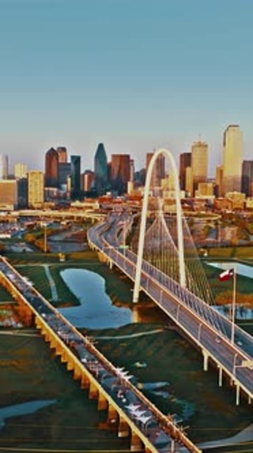 Aerial view of Dallas skyline and bridge at sunset